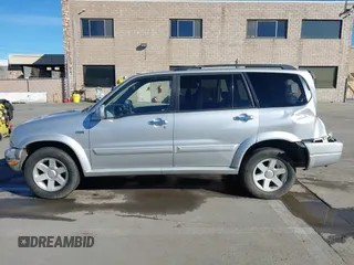 2003 Suzuki XL7 Touring z VIN JS3TX92V734114162, wystawiony jako IAAI lot #41250622 z przebiegiem 227 494 mil mil oraz . Historia ofert i sprzedaży dostępna na DreamBid. Obrazek 15.