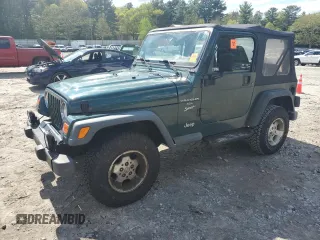 2000 Jeep Wrangler Sport z VIN 1J4FA49S6YP767884, wystawiony jako Copart lot #55303145 z przebiegiem 123 661 mil mil oraz Czysty tytuł • Clean title. Historia ofert i sprzedaży dostępna na DreamBid. Obrazek 1.