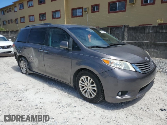 2015 Toyota Sienna XLE with VIN 5TDYK3DCXFS668851, listed as a Copart auction lot 60452005 with 205,549 mi miles and Salvage title. Bid and sale history available at DreamBid. Image 4.