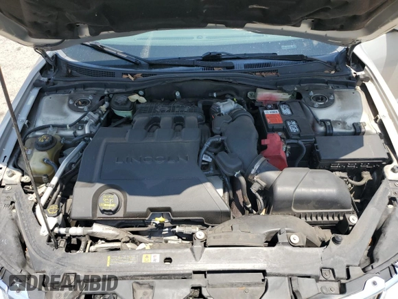 2010 Lincoln MKZ z VIN 3LNHL2GC0AR656881, wystawiony jako Copart lot #57591735 z przebiegiem 76 596 mil mil oraz Szkoda całkowita • Salvage title. Historia ofert i sprzedaży dostępna na DreamBid. Obrazek 11.