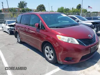 2013 Toyota Sienna LE AAS with VIN 5TDKK3DC1DS394667, listed as a IAAI auction lot 42607647 with 142,889 mi miles and . Bid and sale history available at DreamBid. Image 1.
