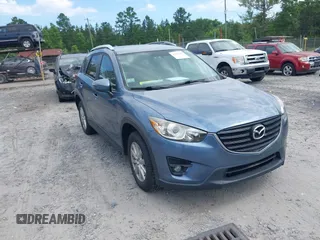 2016 Mazda CX-5 Touring z VIN JM3KE4CY4G0690436, wystawiony jako IAAI lot #42313452 z przebiegiem 67 006 mil mil oraz . Historia ofert i sprzedaży dostępna na DreamBid. Obrazek 1.