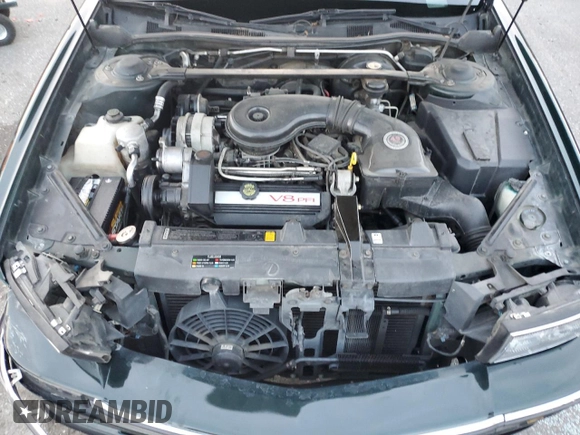 1995 Cadillac DeVille z VIN 1G6KD52B0SU252838, wystawiony jako Copart lot #87642595 z przebiegiem 72 847 mil mil oraz Szkoda całkowita • Salvage title. Historia ofert i sprzedaży dostępna na DreamBid. Obrazek 12.