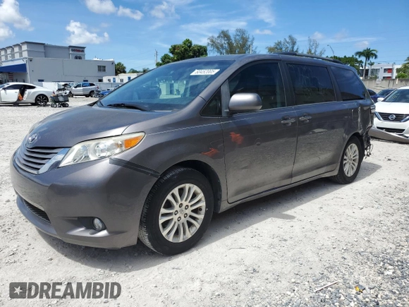 2015 Toyota Sienna XLE with VIN 5TDYK3DCXFS668851, listed as a Copart auction lot 60452005 with 205,549 mi miles and Salvage title. Bid and sale history available at DreamBid. Image 1.