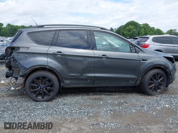 2019 Ford Escape SE z VIN 1FMCU0GD0KUB74569, wystawiony jako IAAI lot #42271476 z przebiegiem 66 335 mil mil oraz . Historia ofert i sprzedaży dostępna na DreamBid. Obrazek 12.
