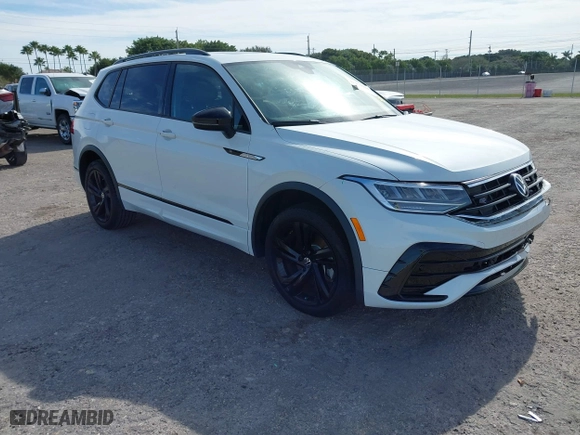 2023 Volkswagen Tiguan SE R-Line Black with VIN 3VVCB7AX0PM090710, listed as a IAAI auction lot 41256904 with 12,819 mi miles. Bid and sale history available at carsss.com. Image 1.