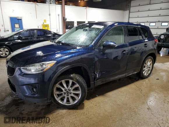 2015 Mazda CX-5 Grand Touring with VIN JM3KE4DY0F0493650, listed as a Copart auction lot 86371104 with 226,752 mi miles and Non Repairable. Bid and sale history available at DreamBid. Image 1.