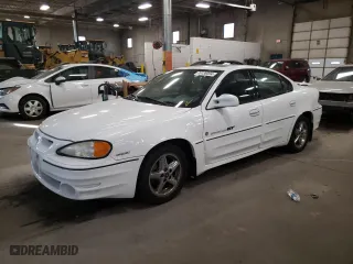 2001 Pontiac Grand Am GT1 with VIN 1G2NV52EX1C228458, listed as a Copart auction lot 76138094 with 118,833 mi miles and Clean Title. Bid and sale history available at carsss.com. Image 1.