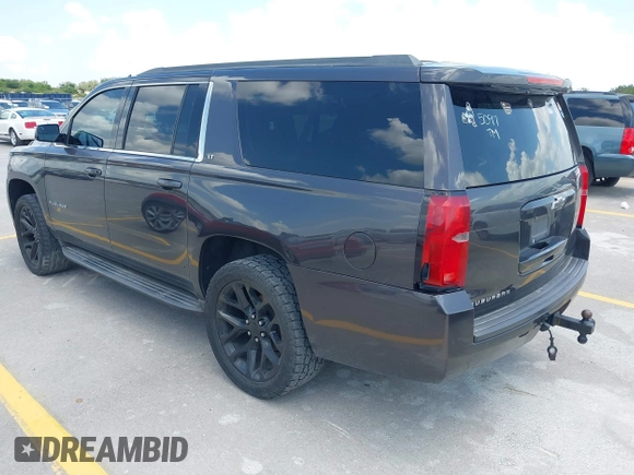 2015 Chevrolet Suburban LT z VIN 1GNSKJKC9FR245097, wystawiony jako IAAI lot #42468168 z przebiegiem 198 454 mil mil oraz . Historia ofert i sprzedaży dostępna na DreamBid. Obrazek 3.