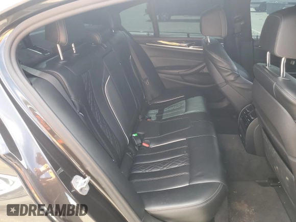 2018 BMW 5 Series M550i xDrive with VIN WBAJB9C57JB286734, listed as a Copart auction lot 52711235 with 127,450 mi miles and Salvage title. Bid and sale history available at DreamBid. Image 10.