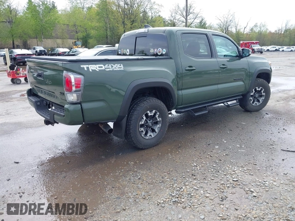 2021 Toyota Tacoma SR with VIN 3TMCZ5AN5MM380286, listed as a IAAI auction lot 42165523 with 58,965 mi miles and . Bid and sale history available at DreamBid. Image 4.