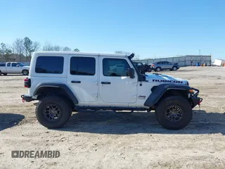 2022 Jeep Wrangler Unlimited Rubicon z VIN 1C4JJXFGXNW121489, wystawiony jako IAAI lot #41749550 z przebiegiem 56 601 mil mil oraz . Historia ofert i sprzedaży dostępna na DreamBid. Obrazek 14.