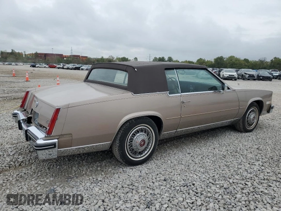 1985 Cadillac Eldorado z VIN 1G6EL5788FE655155, wystawiony jako Copart lot #73223134 z przebiegiem 68 676 mil mil oraz Tytuł czysty. Historia ofert i sprzedaży dostępna na DreamBid. Obrazek 3.