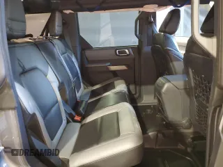 2021 Ford Bronco z VIN 1FMEE5DHXMLA92853, wystawiony jako Copart lot #51822135 z przebiegiem 34 894 mil mil oraz Szkoda całkowita • Salvage title. Historia ofert i sprzedaży dostępna na DreamBid. Obrazek 11.
