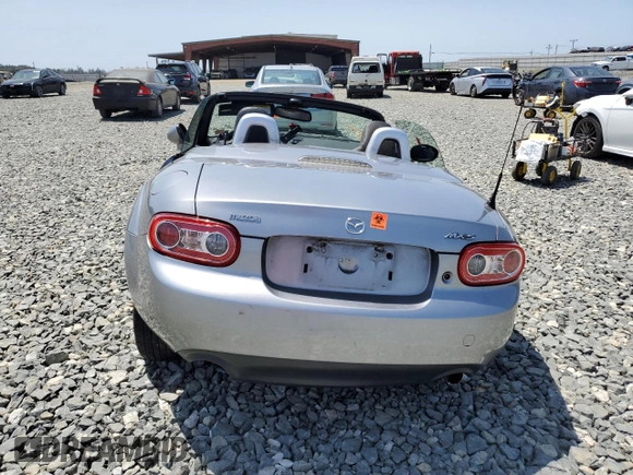 2010 Mazda MX-5 Miata Grand Touring with VIN JM1NC2FF5A0205190, listed as a Copart auction lot 61372455 with 147,852 mi miles and Salvage title. Bid and sale history available at DreamBid. Image 6.