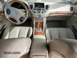 2003 Infiniti Q45 z VIN JNKBF01A03M101890, wystawiony jako Copart lot #86930994 z przebiegiem 158 134 mil mil oraz Szkody całkowita. Historia ofert i sprzedaży dostępna na DreamBid. Obrazek 8.