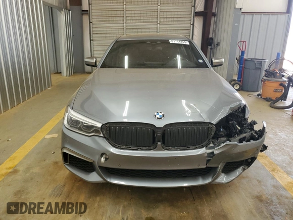 2018 BMW 5 Series M550i xDrive with VIN WBAJB9C55JB050213, listed as a Copart auction lot 61714255 with 34,700 mi miles and Salvage title. Bid and sale history available at DreamBid. Image 5.