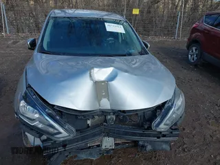 2019 Nissan Sentra S z VIN 3N1AB7APXKY372220, wystawiony jako IAAI lot #41723914 z przebiegiem 103 308 mil mil oraz . Historia ofert i sprzedaży dostępna na DreamBid. Obrazek 6.