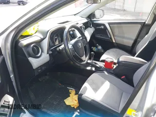 2016 Toyota RAV4 Hybrid XLE with VIN JTMRJREVXGD029019, listed as a IAAI auction lot 42021530 with 74,400 mi miles. Bid and sale history available at carsss.com. Image 18.