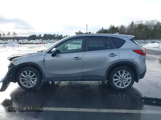 2014 Mazda CX-5 Grand Touring with VIN JM3KE2DY8E0304911, listed as a IAAI auction lot 41672197 with 77,523 mi miles. Bid and sale history available at carsss.com. Image 14.