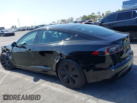 2022 Tesla Model S with VIN 5YJSA1E5XNF467435, listed as a IAAI auction lot 42538706 with 26,504 mi miles and . Bid and sale history available at DreamBid. Image 14.