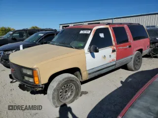 1994 GMC Suburban z VIN 1GKFK16K0RJ751324, wystawiony jako Copart lot #77827404 z przebiegiem 219 786 mil mil oraz Szkoda całkowita • Salvage title. Historia ofert i sprzedaży dostępna na DreamBid. Obrazek 1.