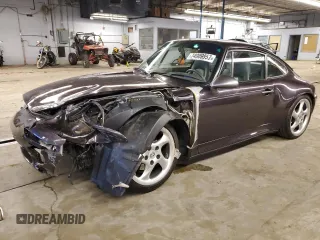 1998 Porsche 911 z VIN WP0ZZZ99ZWS310288, wystawiony jako Copart lot #74909953 z przebiegiem Nie podano mil oraz Szkoda całkowita • Salvage title. Historia ofert i sprzedaży dostępna na DreamBid. Obrazek 1.
