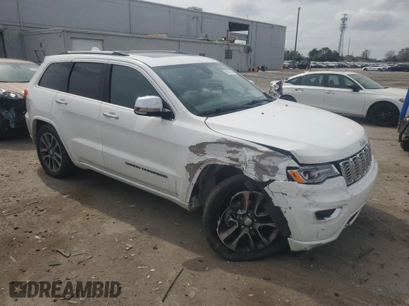 2018 Jeep Grand Cherokee Overland with VIN 1C4RJFCG5JC437508, listed as a Copart auction lot 51814795 with 104,598 mi miles and Salvage title. Bid and sale history available at DreamBid. Image 4.