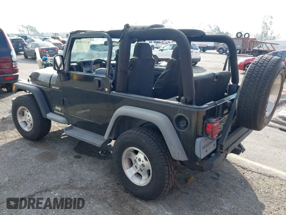 2003 Jeep Wrangler Sport with VIN 1J4FA49S23P328867, listed as a IAAI auction lot 41354414 with 96,703 mi miles. Bid and sale history available at carsss.com. Image 3.