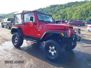 2001 Jeep Wrangler Sport z VIN 1J4FA49S61P344664, wystawiony jako IAAI lot #42259687 z przebiegiem 99 568 mil mil oraz . Historia ofert i sprzedaży dostępna na DreamBid. Obrazek 1.
