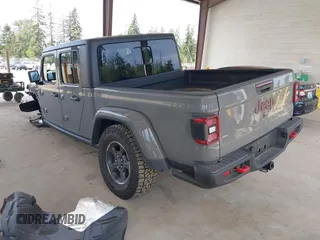 2022 Jeep Gladiator Rubicon with VIN 1C6JJTBG6NL166081, listed as a IAAI auction lot 42204431 with 40,568 mi miles and . Bid and sale history available at DreamBid. Image 3.