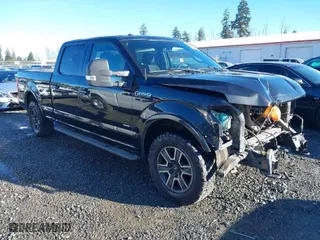 2015 Ford F-150 XLT w/HD Payload Pkg with VIN 1FTFW1EG5FFC13942, listed as a IAAI auction lot 41392709 with 196,416 mi miles. Bid and sale history available at carsss.com. Image 1.