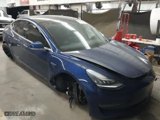 2019 Tesla Model 3 Mid Range with VIN 5YJ3E1EA8KF311623, listed as a IAAI auction lot 41835206 with 68,876 mi miles. Bid and sale history available at carsss.com. Image 1.