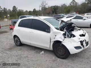 2009 Toyota Yaris with VIN JTDKT903595236903, listed as a IAAI auction lot 41309108 with 140,624 mi miles. Bid and sale history available at carsss.com. Image 1.