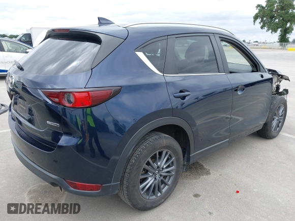 2020 Mazda CX-5 Touring with VIN JM3KFACM2L0856777, listed as a IAAI auction lot 42073972 with 151,628 mi miles. Bid and sale history available at carsss.com. Image 4.