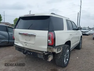 2015 GMC Yukon Denali z VIN 1GKS1CKJ3FR713531, wystawiony jako IAAI lot #41866691 z przebiegiem 157 666 mil mil oraz . Historia ofert i sprzedaży dostępna na DreamBid. Obrazek 6.