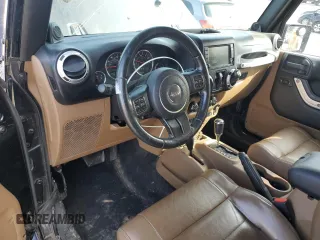 2011 Jeep Wrangler Sahara with VIN 1J4AA5D15BL552185, listed as a Copart auction lot 63065185 with 159,850 mi miles and Salvage title. Bid and sale history available at DreamBid. Image 8.
