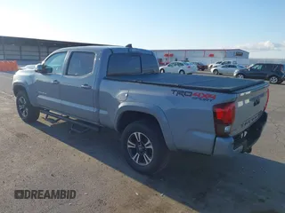2018 Toyota Tacoma SR5 with VIN 3TMDZ5BN3JM054548, listed as a IAAI auction lot 42038480 with 122,242 mi miles and . Bid and sale history available at DreamBid. Image 3.
