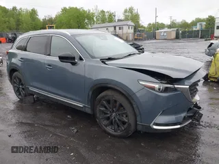 2021 Mazda CX-9 Grand Touring z VIN JM3TCBDY8M0528365, wystawiony jako IAAI lot #42222394 z przebiegiem 44 850 mil mil oraz . Historia ofert i sprzedaży dostępna na DreamBid. Obrazek 1.
