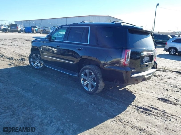 2017 GMC Yukon Denali with VIN 1GKS2CKJ6HR297412, listed as a IAAI auction lot 41330984 with 99,472 mi miles. Bid and sale history available at carsss.com. Image 3.