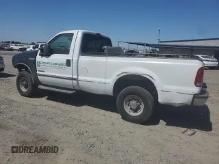 2000 Ford F-250 XL with VIN 1FTNF21F0YEC85459, listed as a Copart auction lot 63040505 with 328,049 mi miles and Salvage title. Bid and sale history available at DreamBid. Image 2.