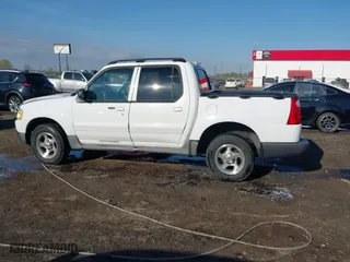 2004 Ford Explorer Sport Trac XLS with VIN 1FMZU67K04UC22800, listed as a IAAI auction lot 41869208 with 157,711 mi miles. Bid and sale history available at carsss.com. Image 14.