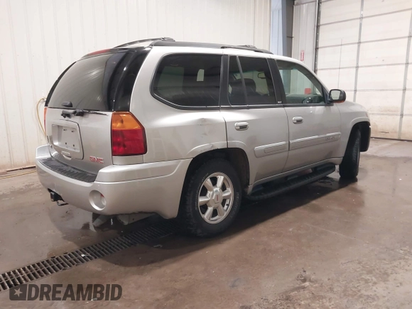 2004 GMC Envoy SLE with VIN 1GKDT13S042243883, listed as a IAAI auction lot 41795335 with 162,873 mi miles. Bid and sale history available at carsss.com. Image 4.