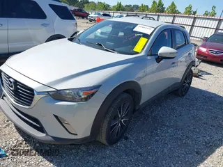 2018 Mazda CX-3 Touring z VIN JM1DKFC77J0331828, wystawiony jako IAAI lot #40482555 z przebiegiem 101 473 mil mil oraz . Historia ofert i sprzedaży dostępna na DreamBid. Obrazek 2.