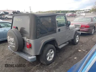 2002 Jeep Wrangler Sport with VIN 1J4FA49SX2P706691, listed as a IAAI auction lot 41965852 with 179,553 mi miles. Bid and sale history available at carsss.com. Image 4.