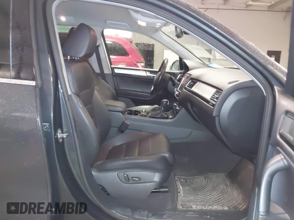 2013 Volkswagen Touareg Lux with VIN WVGEF9BP6DD007032, listed as a IAAI auction lot 41684721 with 147,249 mi miles and . Bid and sale history available at DreamBid. Image 5.
