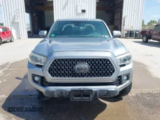 2018 Toyota Tacoma SR with VIN 3TMCZ5AN3JM170037, listed as a IAAI auction lot 42565385 with 157,450 mi miles and . Bid and sale history available at DreamBid. Image 12.