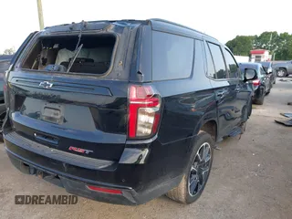 2024 Chevrolet Tahoe RST with VIN 1GNSCRKDXRR145972, listed as a IAAI auction lot 42216403 with 30,952 mi miles and . Bid and sale history available at DreamBid. Image 4.