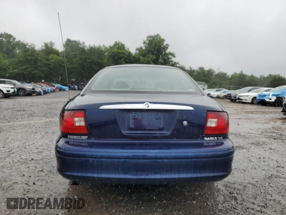 2003 Mercury Sable GS z VIN 1MEFM50U83G602556, wystawiony jako Copart lot #61019515 z przebiegiem 94 998 mil mil oraz Czysty tytuł • Clean title. Historia ofert i sprzedaży dostępna na DreamBid. Obrazek 6.