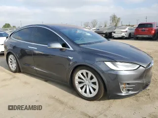 2016 Tesla Model X 70D with VIN 5YJXCAE2XGF001562, listed as a Copart auction lot 53539225 with 73,274 mi miles and Salvage Title. Bid and sale history available at carsss.com. Image 4.